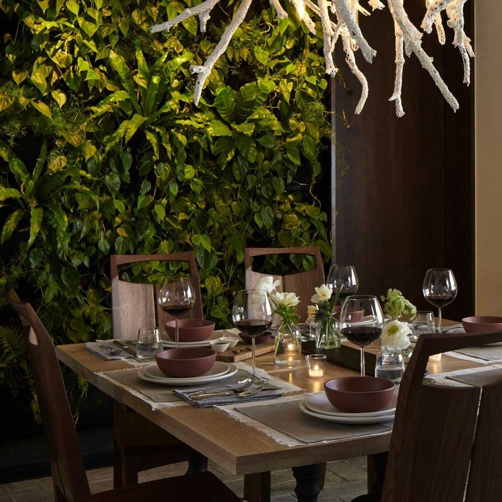 living green wall filled with native flora creates an inviting and calming atmosphere