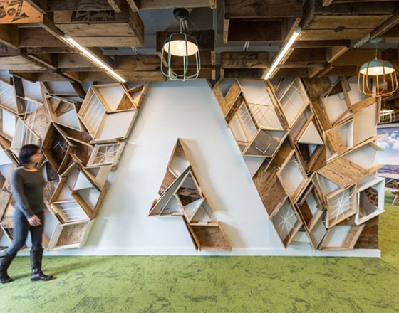 adobe office headquarters with geometric bookshelf in the shape of their logo